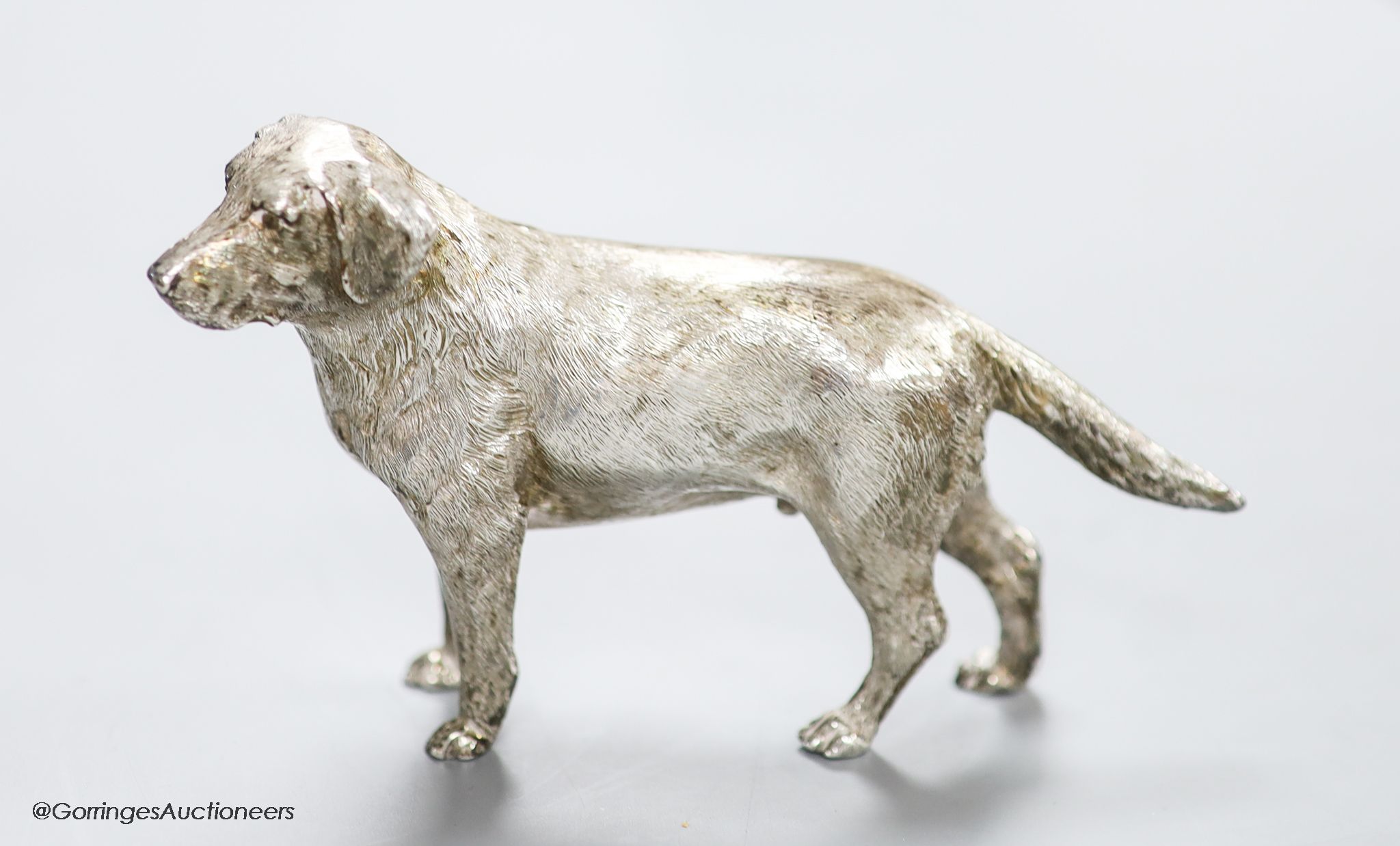 A modern free standing silver miniature model of a dog, C.F.H & Co, London, 1994, height 76mm, 243 grams.